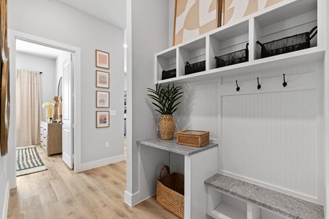A hallway with a built in mudroom.