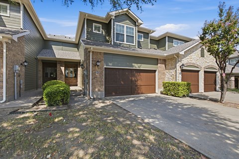 A modern house with a grey garage door.