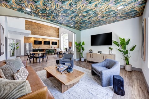 A living room with a wooden coffee table and a grey armchair.