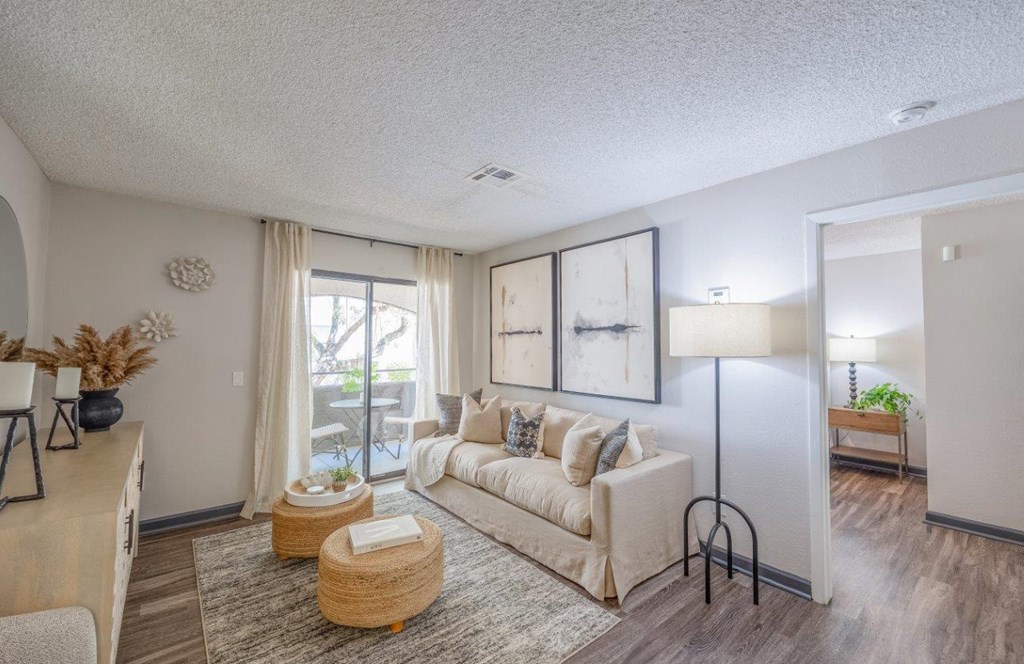 a living room with a couch and a window
