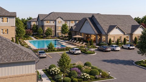 A large building with a pool in front of it.