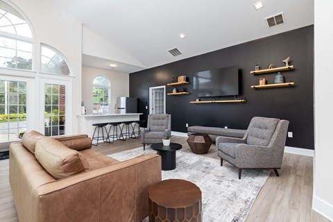 clubhouse with a sitting area, a TV, and a kitchen area