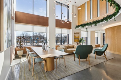 A modern conference room with a long table and chairs.