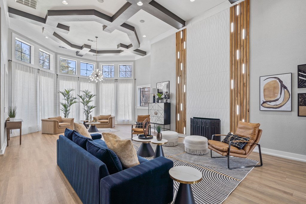 a living room with couches and chairs and a fireplace