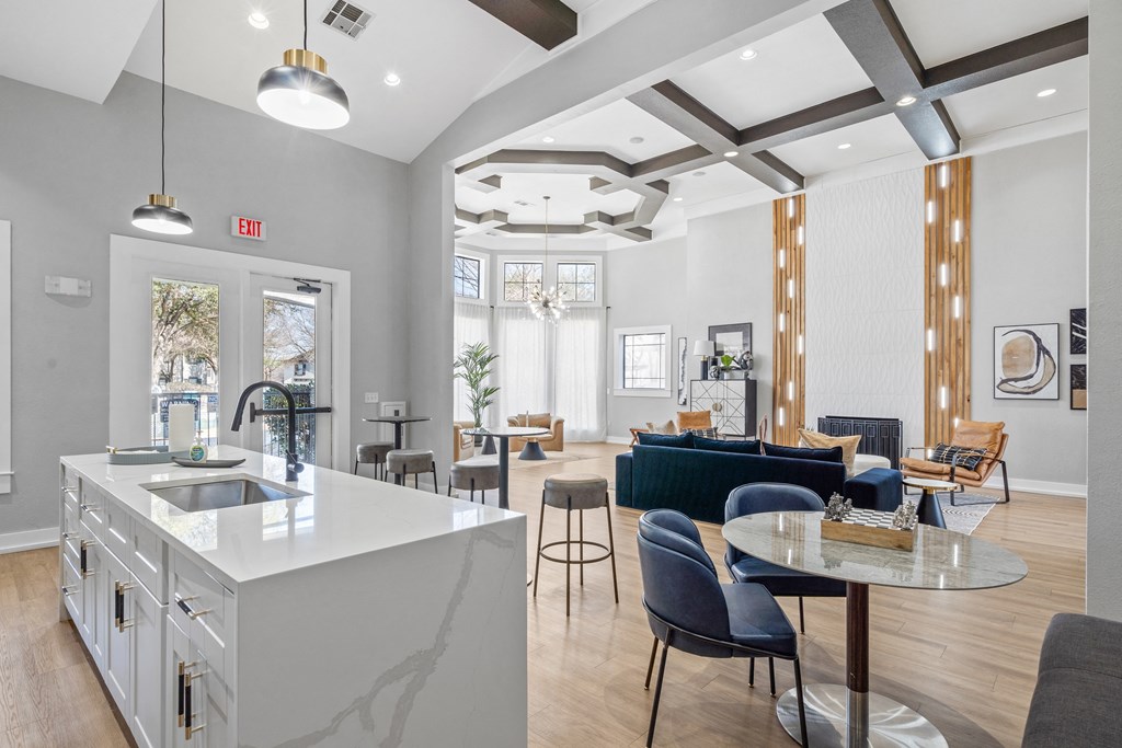 a living room with a kitchen and a dining room
