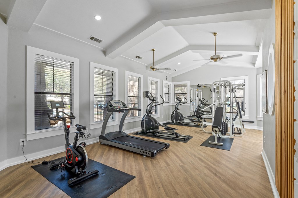 the gym with treadmills and other exercise equipment at 1861 muleshoe road
