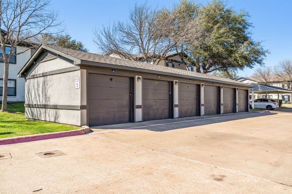a row of garage doors on the side of a building
