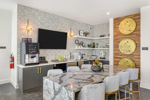 a kitchen and dining room with a table and chairs