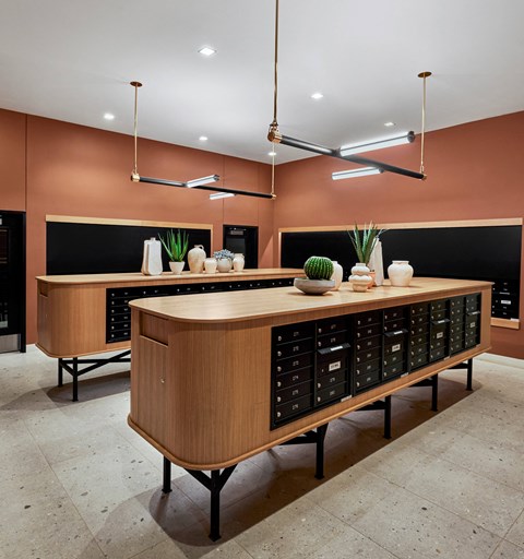 Indoor mail room with large tables, ceiling lighting