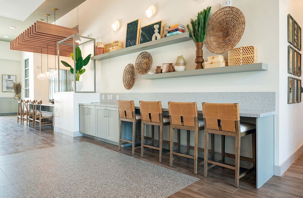 a dining room with a table and chairs and a counter