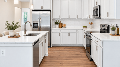 Modern kitchen with spacious countertops at Sunstone Grove in Waldorf MD