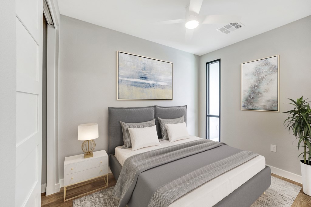 a bedroom with a large bed and a window