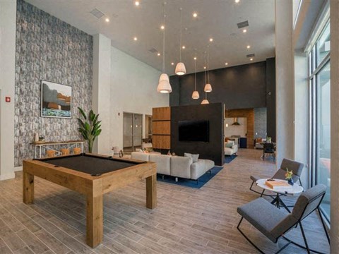 a large living room with a pool table