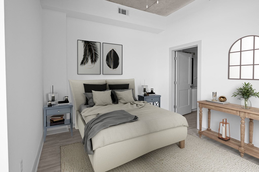 a bedroom with a large bed in a 555 waverly unit