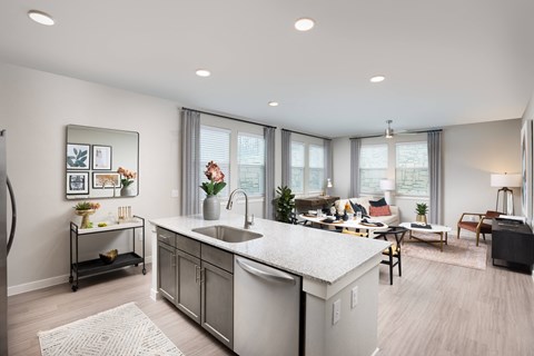 an open floor plan with a kitchen and living room