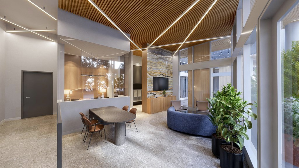 a living room and dining room with a table and chairs