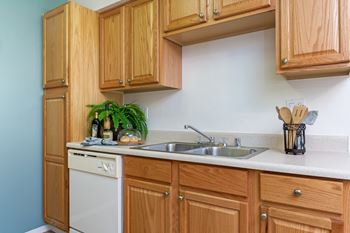 Kitchen with wooden cabinets at Softwind Point, Vista. CA, 92081