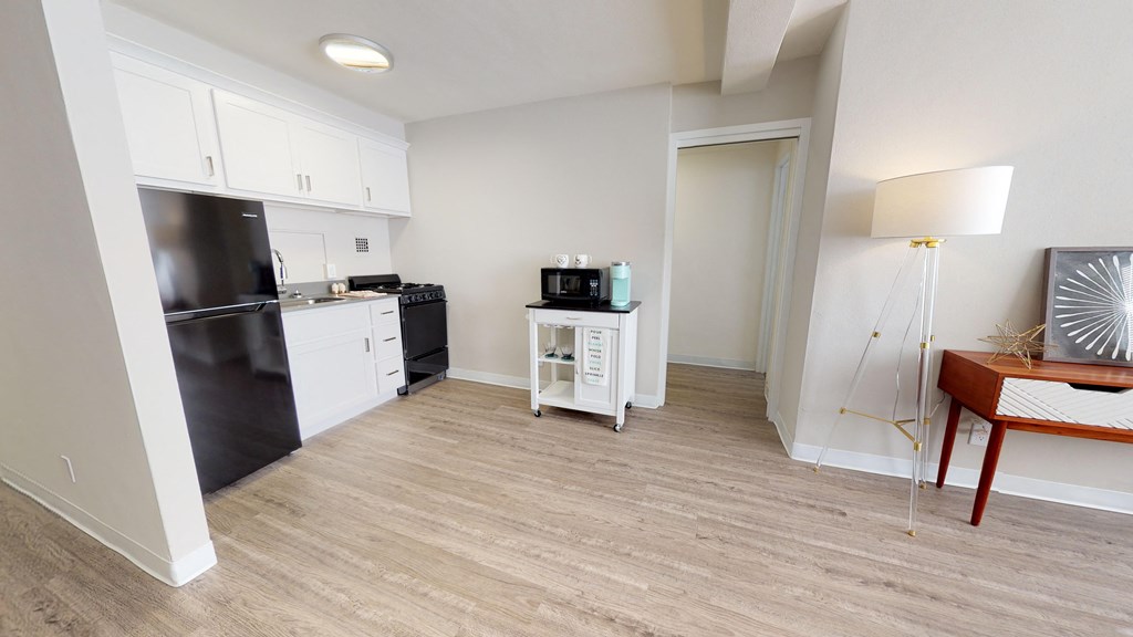a kitchen and living room in a 555 waverly unit