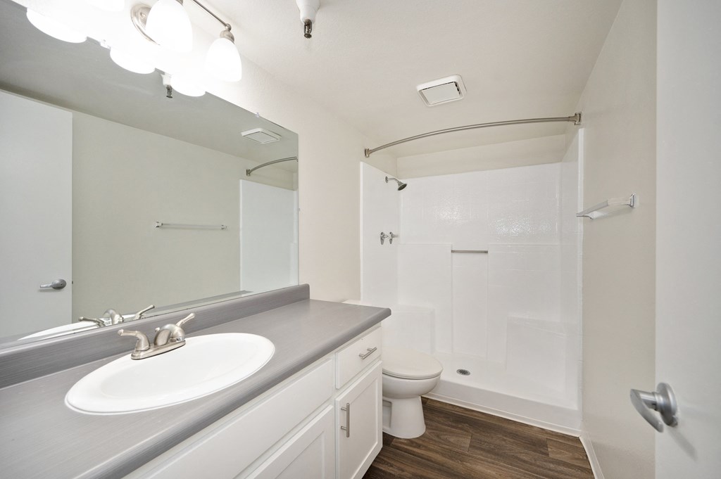 a 2-bedroom apartment bathroom with a sink and a toilet