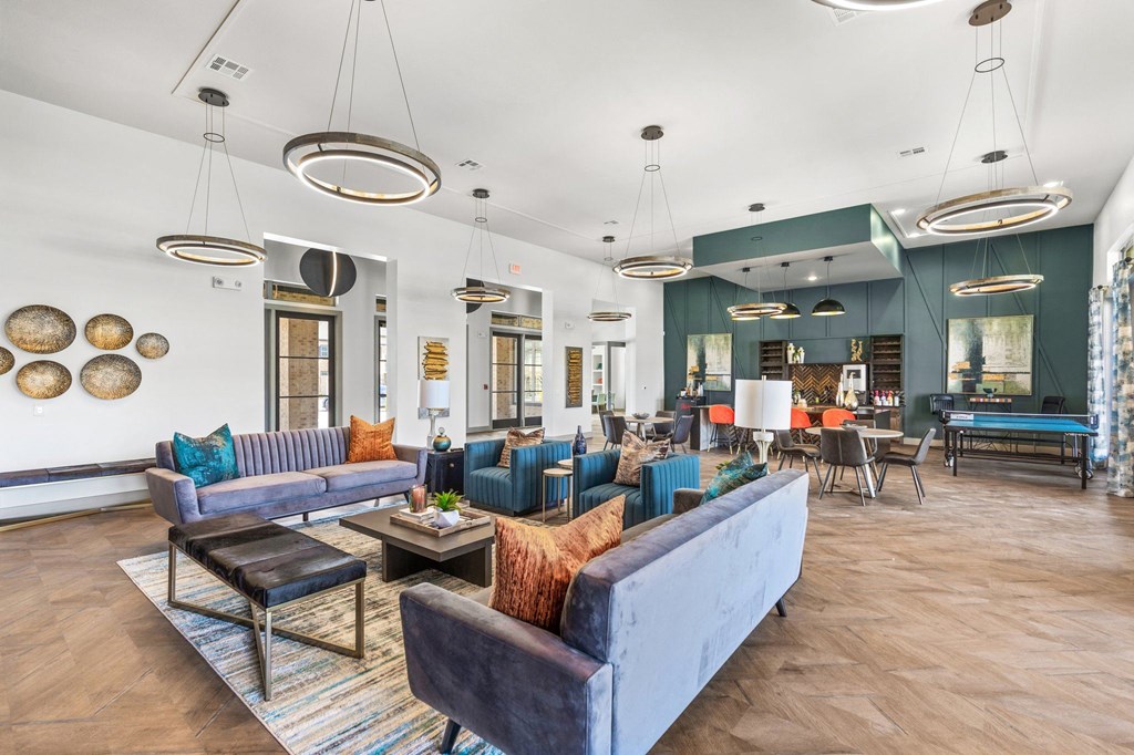 a living room filled with furniture and a large window