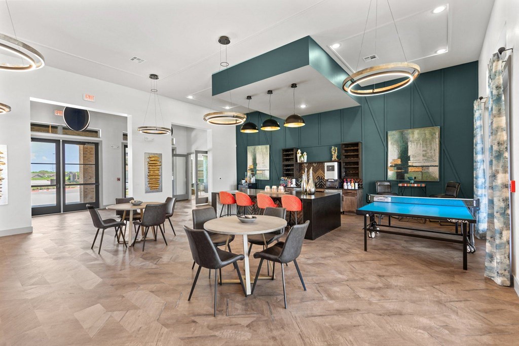 resident lounge with a ping pong table and a pool table