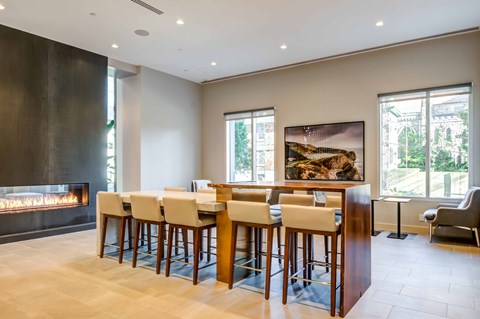a dining room with a table and chairs and a fireplace