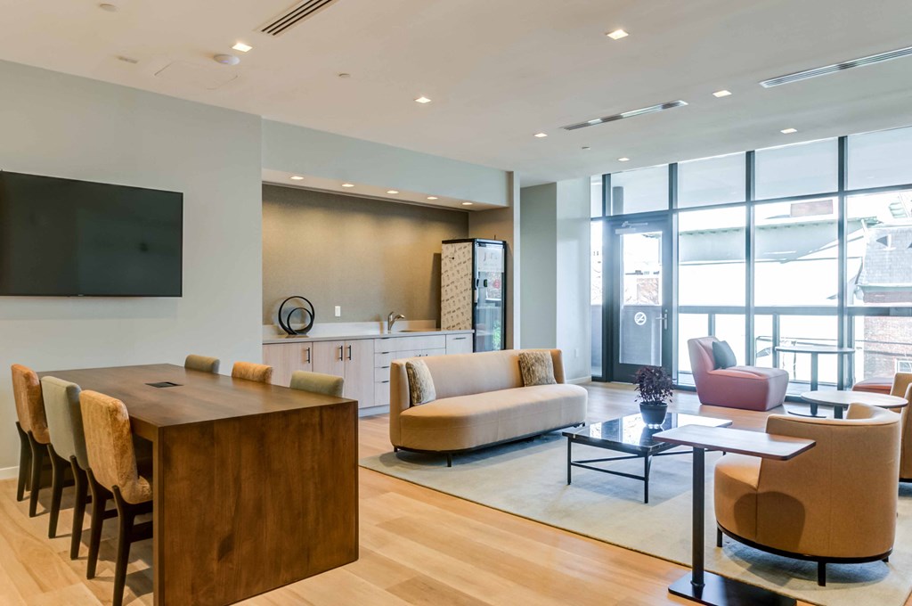 a living room with a couch and a table and chairs