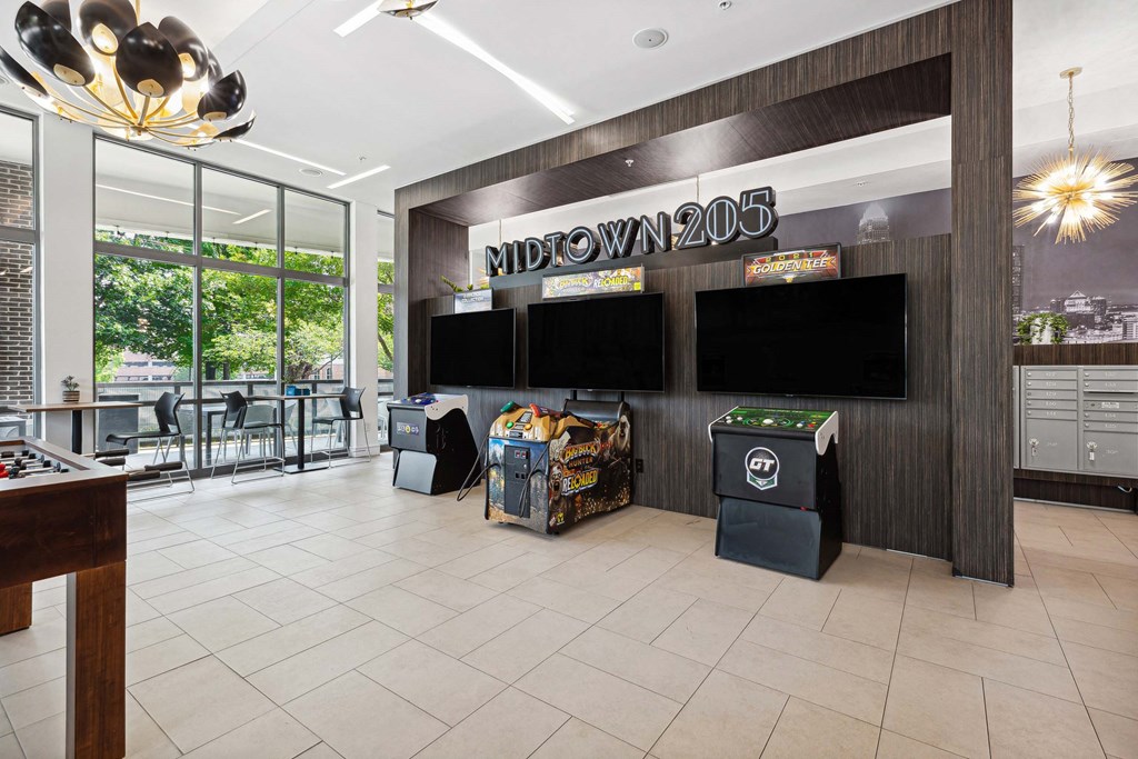 a view of the lobby at midtown 206 with a variety of games on the wall and