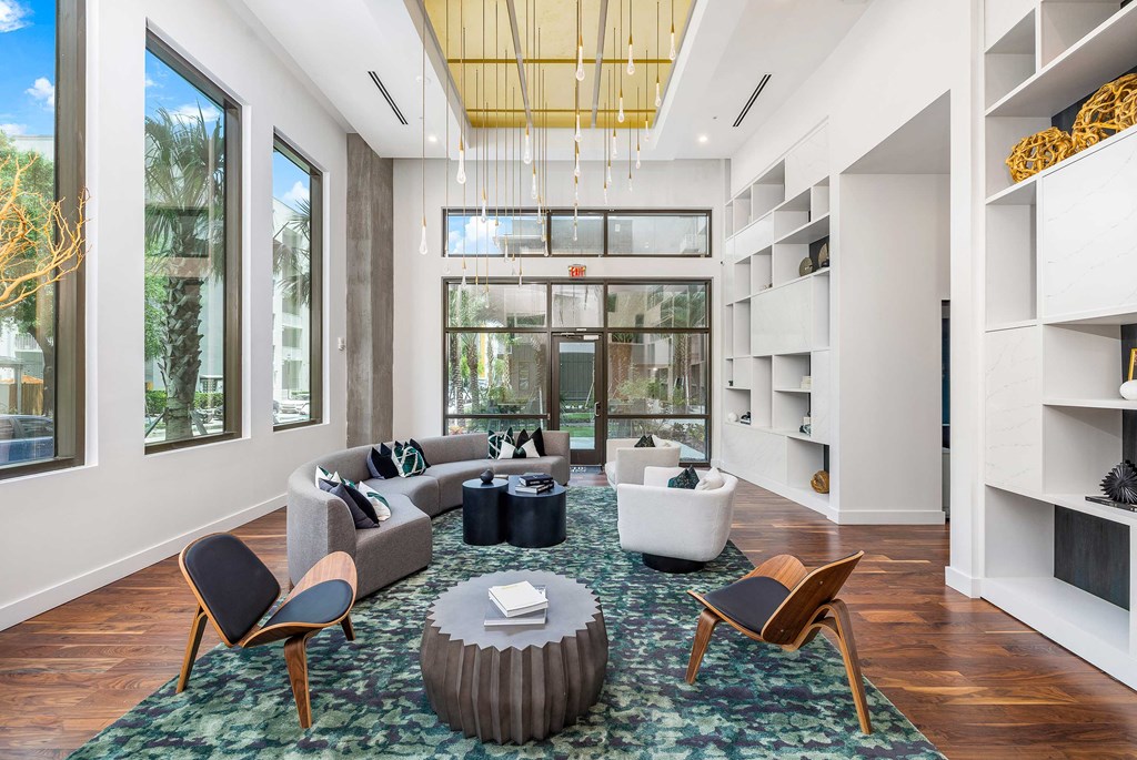a living room with furniture and a large window