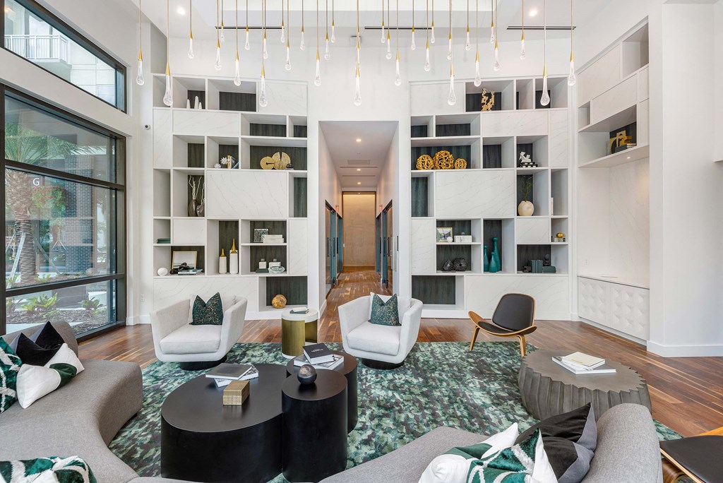 a living room filled with furniture and a large window