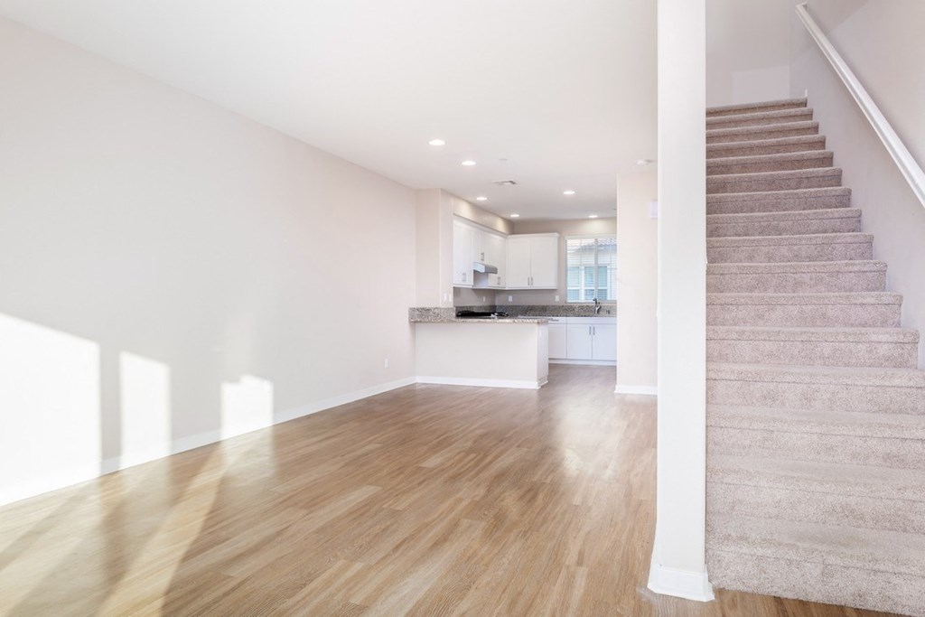 Living room With Staircase at Ocean Air, San Diego, CA