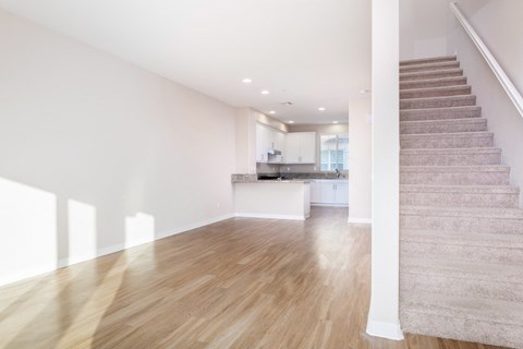 Living room With Staircase at Ocean Air, San Diego, CA
