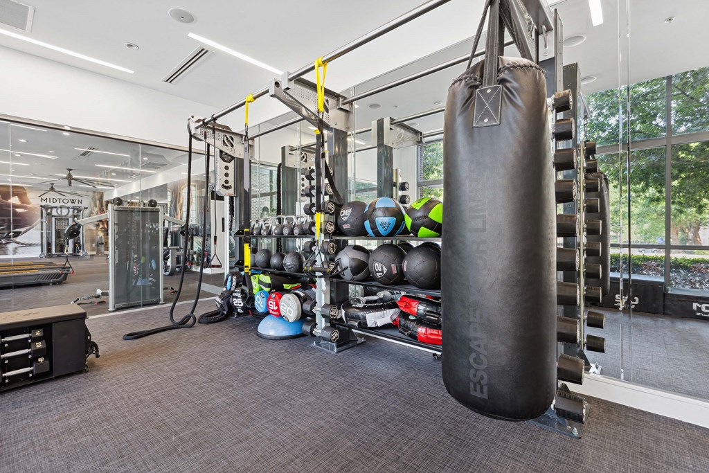 a large punching bag hangs in the corner of a gym