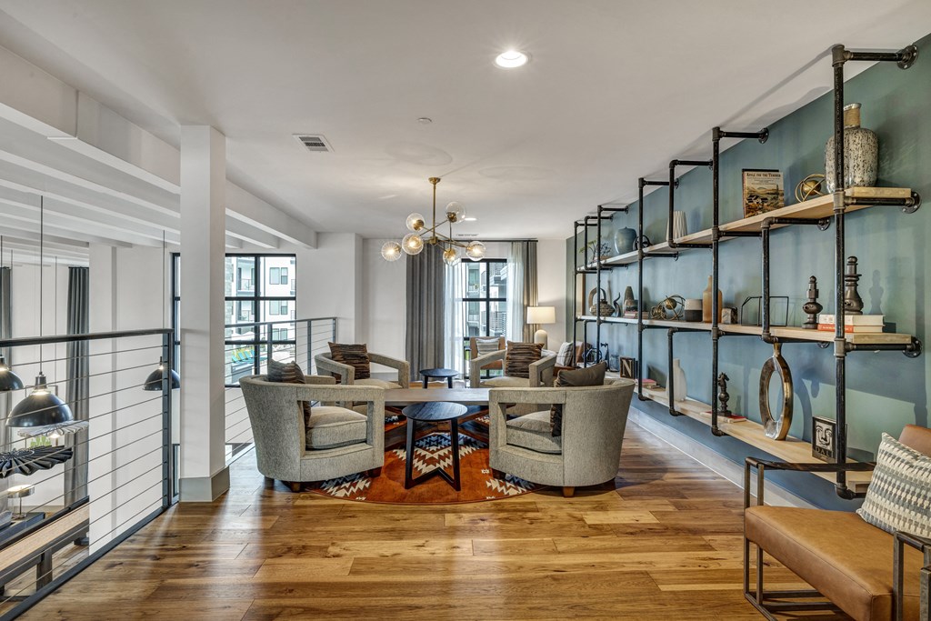 a living room with couches and chairs and a table