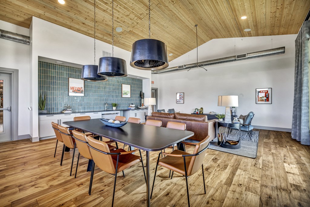 a dining room with a table and chairs and a living room
