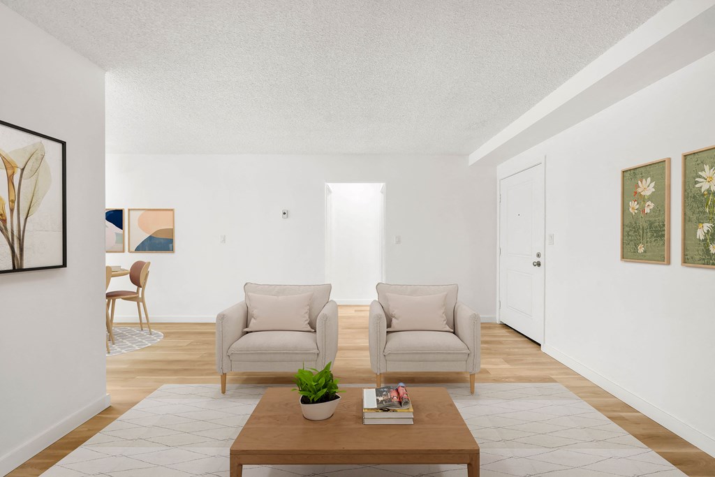 a living room with two chairs and a coffee table