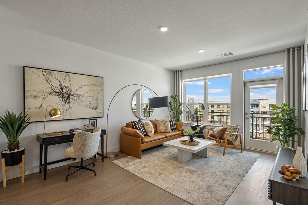 the living room of an apartment with a couch and a table