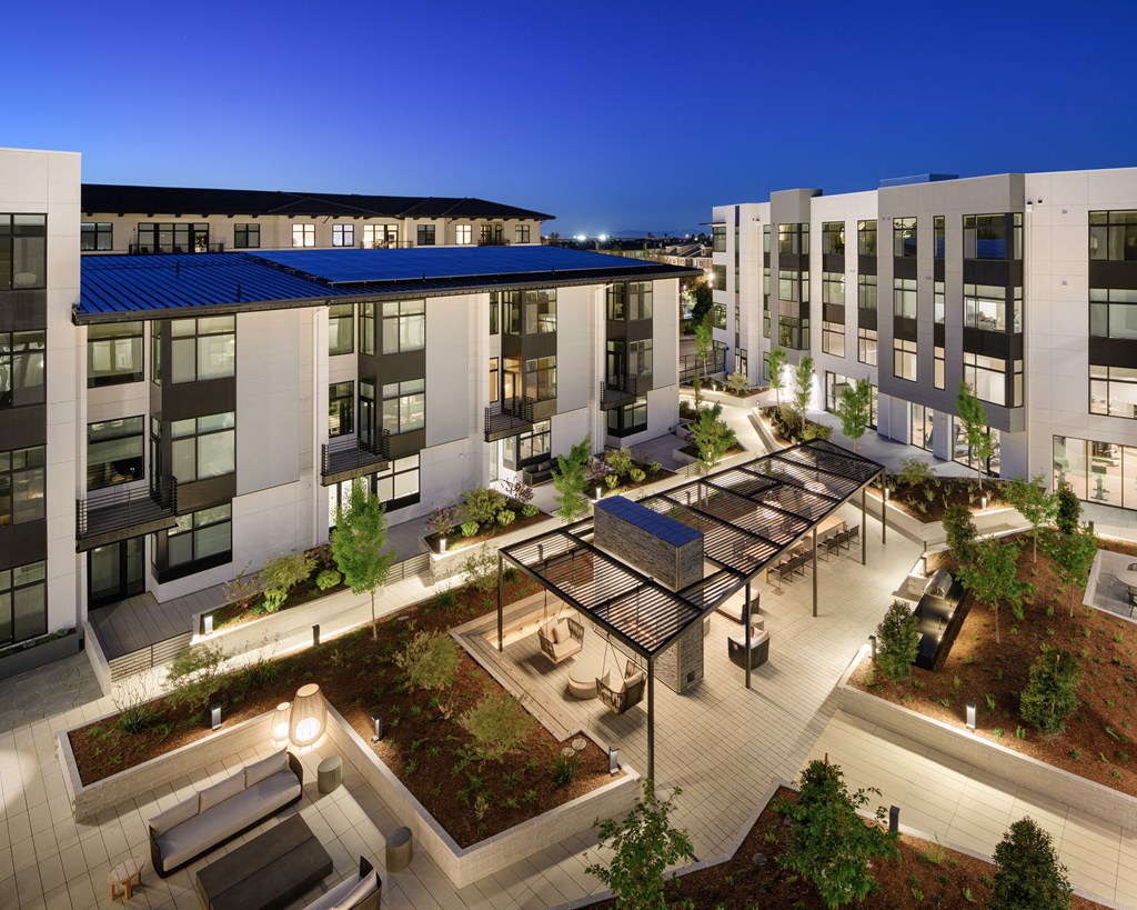 an aerial view of an apartment complex at night