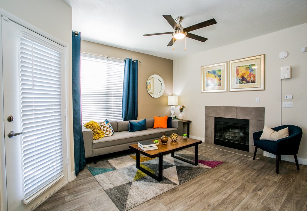 A living room with a fireplace and a couch.