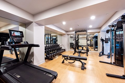 A gym with a treadmill, weights, and exercise equipment. at 1700 California Street, San Francisco, 94109