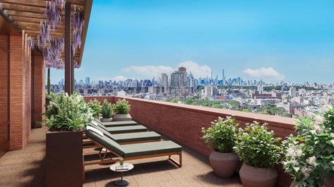 A balcony with a chair and a table with a view of a city skyline.