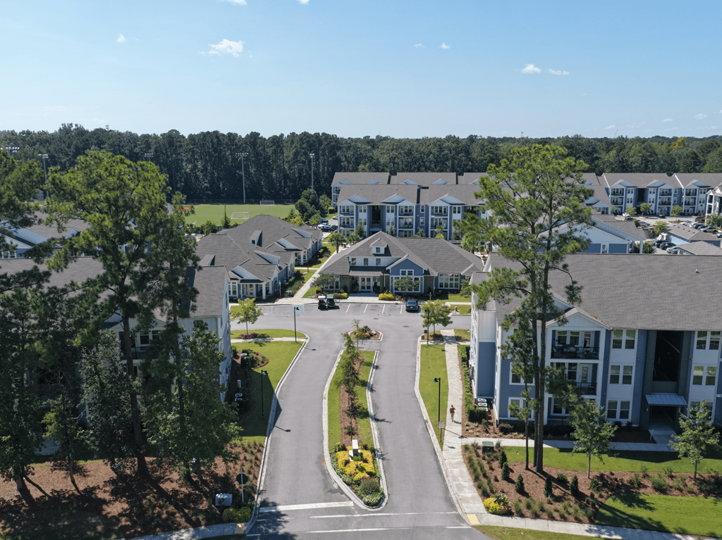 A view of a residential area with houses and trees.