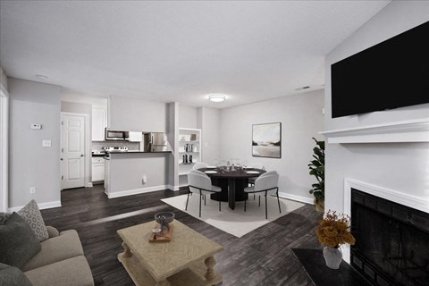 A modern living room with a fireplace and a dining table set up.