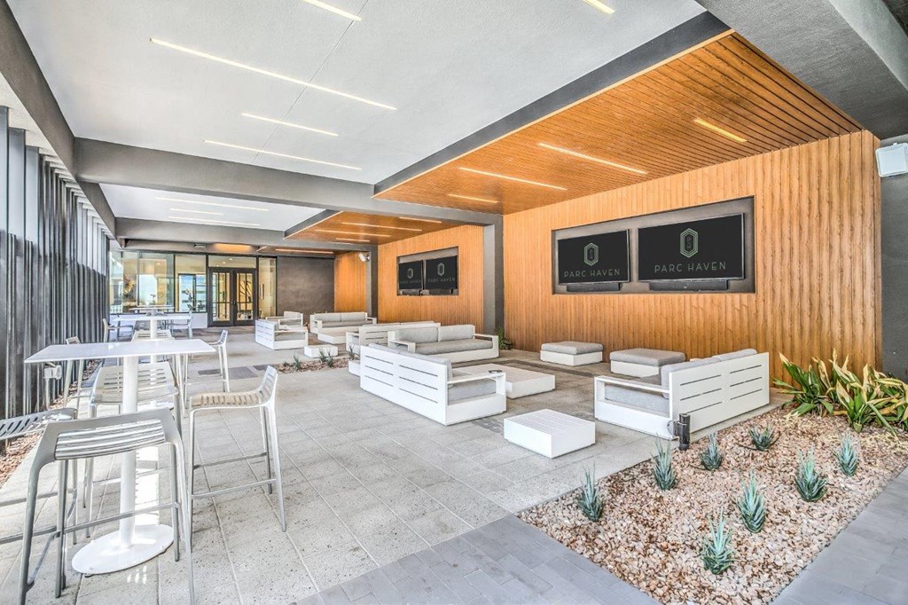 Covered outdoor seating area with TVs