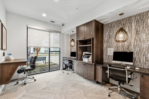 A modern office space with wood paneling and a large window.