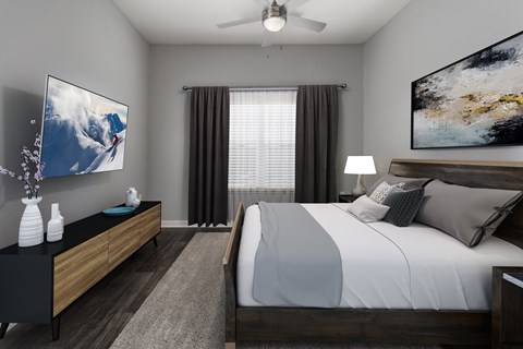 A modern bedroom with a large bed and a television on the wall.