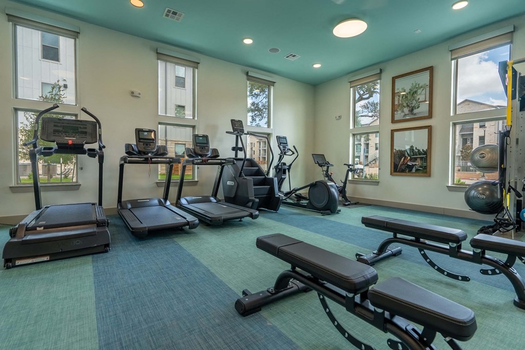 the gym at the district flats apartments in lenexa