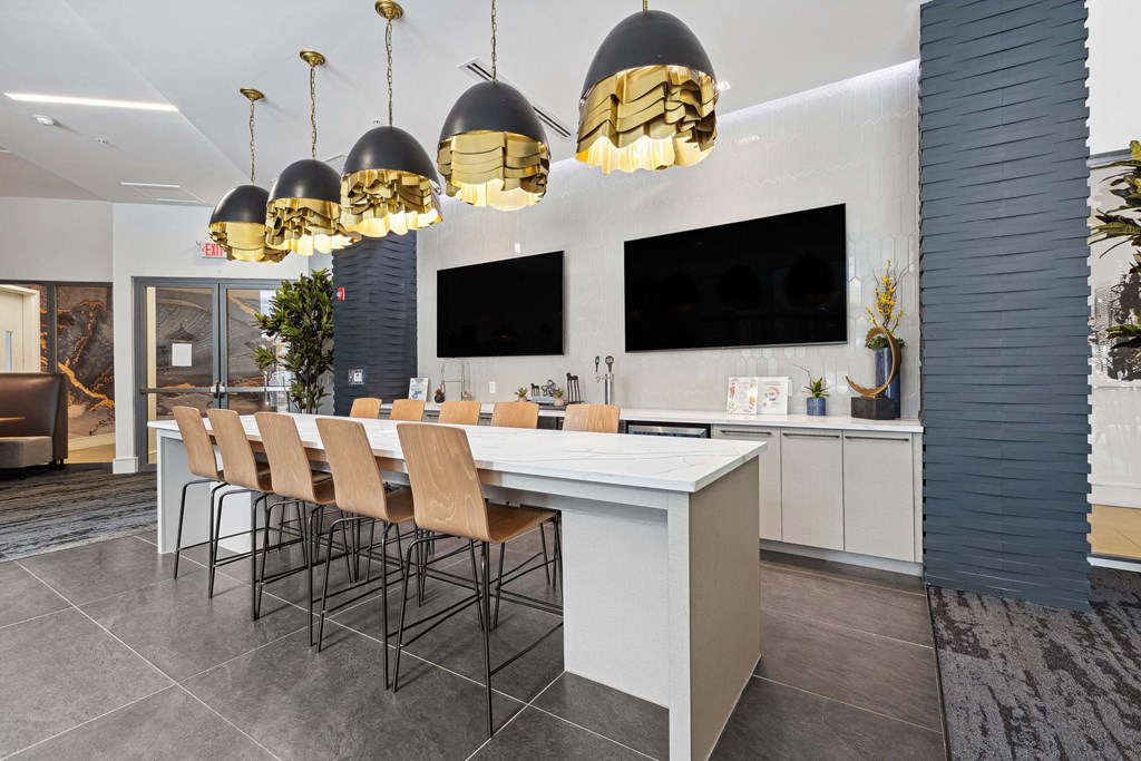 a room with a long table and chairs