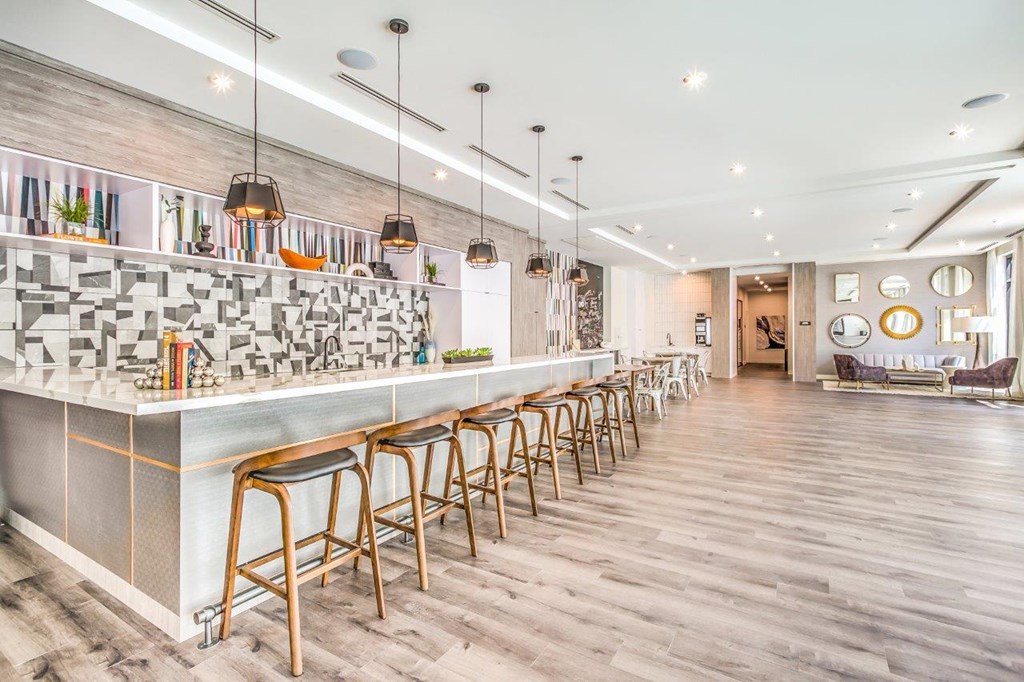a long bar with stools in front of it