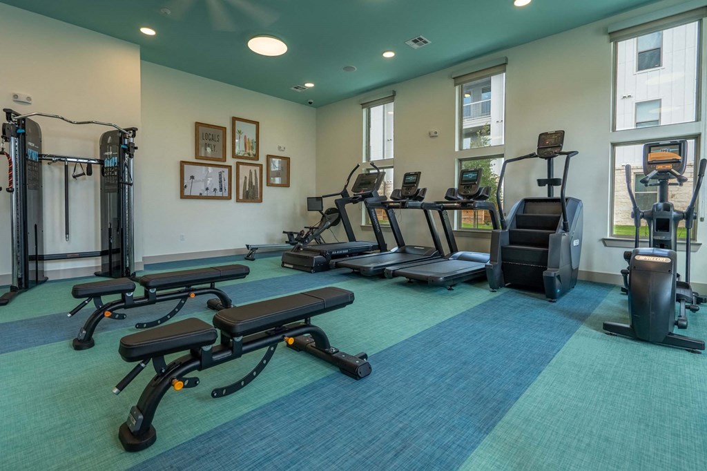 the gym at the district flats apartments in lenexa
